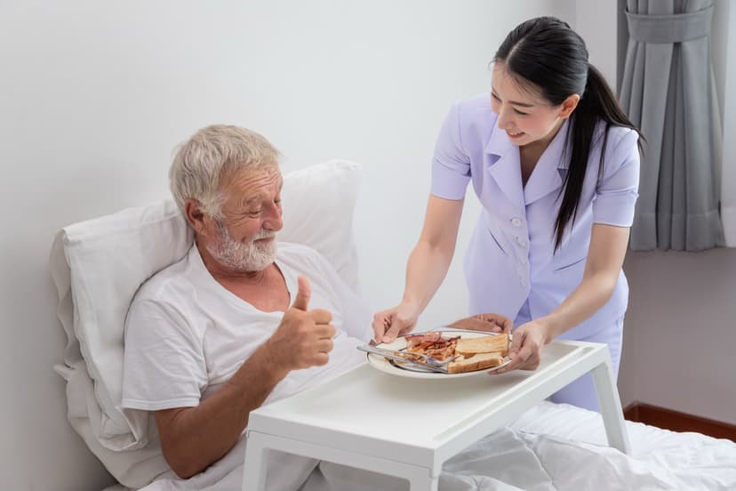A carer at a patient's bedside at home